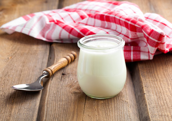 Delicious, nutritious and healthy yogurt in a glass jars with sp