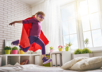 girl in an Superman's costume