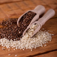 Two kind of seeds on wooden table