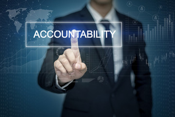 Businessman hand touching ACCOUNTABILITY  button on virtual scre