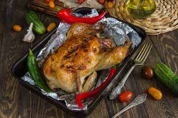 A whole roast chicken, chilli,fresh tomatoes, cucumbers