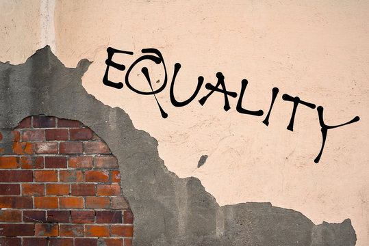 EQUALITY text sprayed on the old wall, anarchist aesthetics 