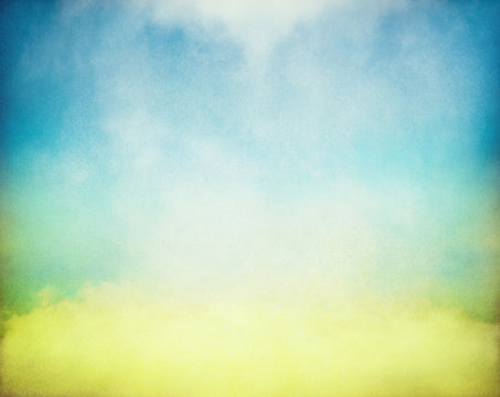 Fog and mist rising from a glowing pool of yellow and green light.  Image has a distinct paper texture and grain pattern visible at 100 percent.