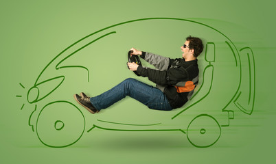 Man drives an eco friendy electric hand drawn car