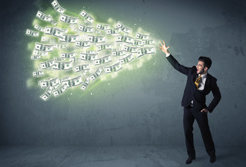 Business person throwing a lot of dollar bills concept