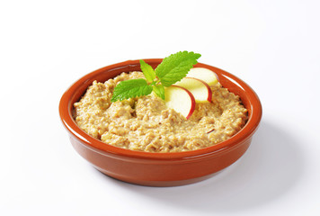 Oatmeal porridge with sliced apple
