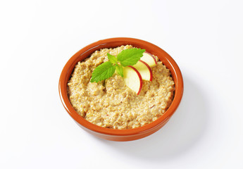 Oatmeal porridge with sliced apple