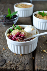 Blackberry crumble with oatmeal and almonds, rustic style