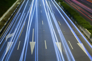 Light trails over traffic signs on great avenue