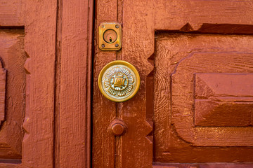 Old handle on the wooden door in Santa Cruz de la Palma city in Spain. Architectural detail close-up view.