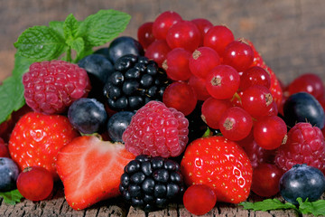 Fresh berries with mint leaves