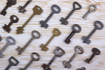 Old keys on wooden background