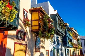 Famous ancient colorful balconies decorated with flowers in Santa Cruz city on La Palma island in...