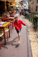Obraz premium Sweet portrait of preschool boy in the town of Annecy, France, s