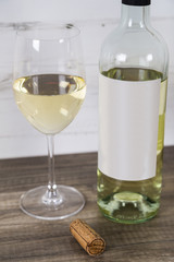 Glass of White Wine with Bottle