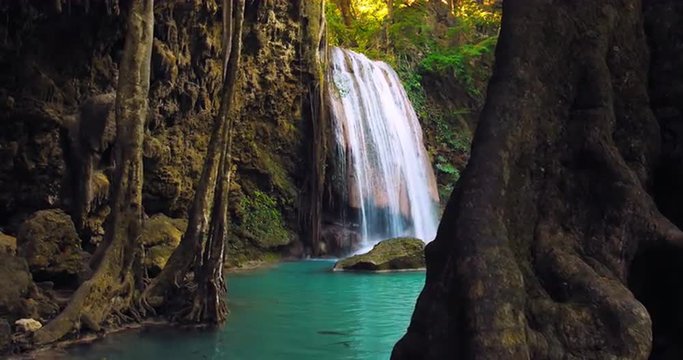 Amazing nature of Thailand rainforest national park. Waterfall flows in pond