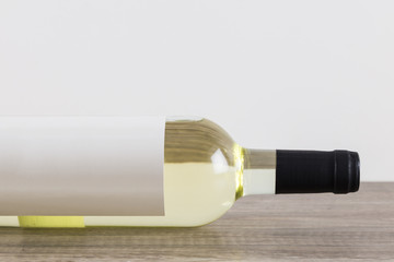 White wine bottle on its side
