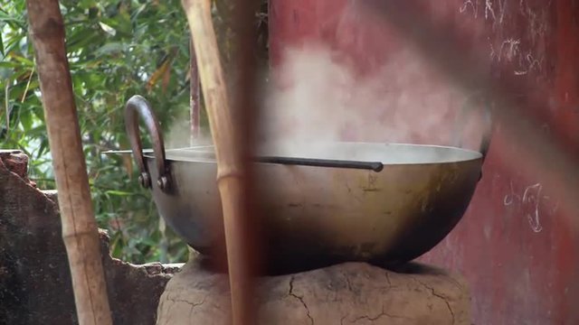 Closeup view of large steaming pot