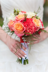 wedding bouquet in the hands of  bride