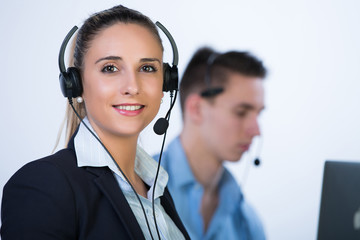 Portrait of happy smiling cheerful support phone operator in headset, isolated on white background