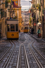 A street scene with crossed tracks and funiculars in Lisbon, Portugal