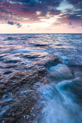 Long exposure sea and rocks at twilight