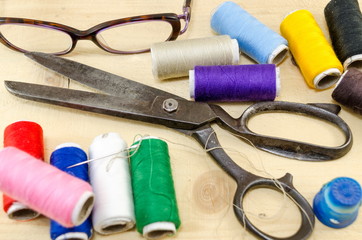 Fototapeta na wymiar Sewing equipment chaos on the table
