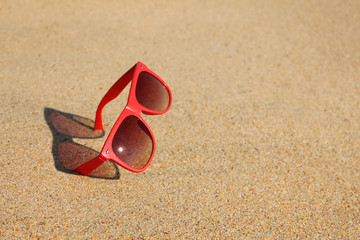 Red sunglasses on the beach