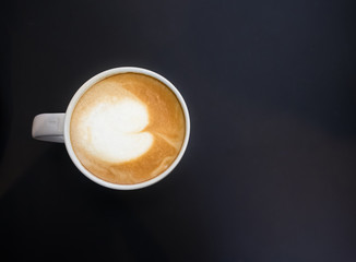 Top view of white mug cup containing hot coffee