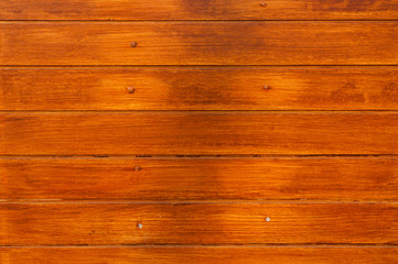 Fototapeta premium Brown wooden wall background detail.