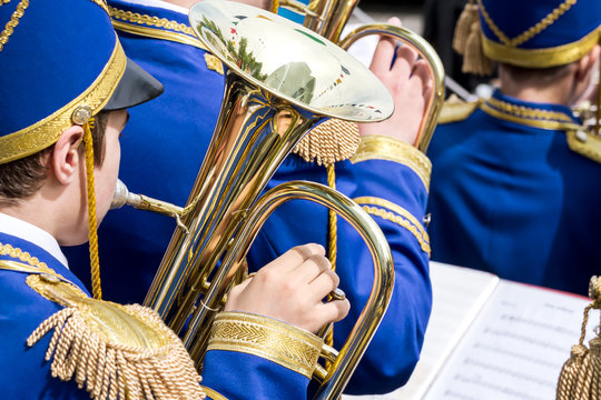 musician with brass tuba at street concert