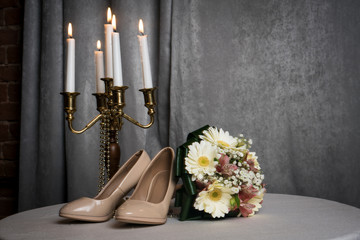shoes, bride's bouquet and chandelier
