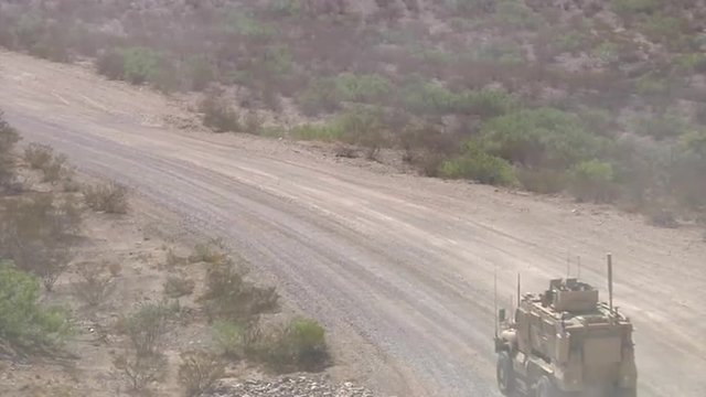 Marines on patrol in Afghanistan use mine sweeping trucks to detect IED's.