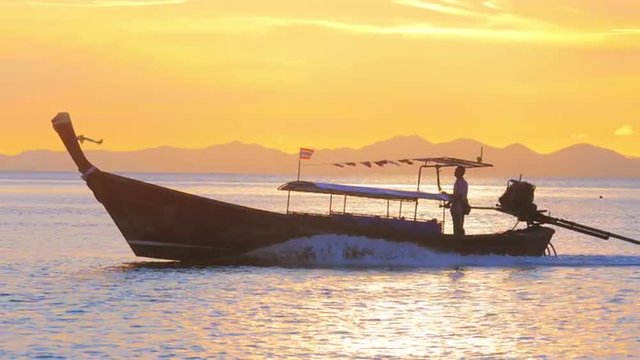 Vacations in Thailand, Asia scenic background of thai boat ship in evening after sunset on tropical sea coast