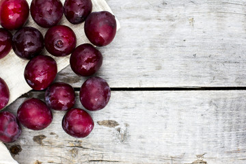 Sweet plums on wooden background