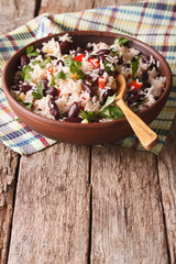 Rice with red beans and other vegetables in a bowl. vertical
