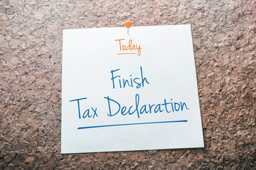 Finish Tax Declaration Reminder For Today On Paper Pinned On Cork Board