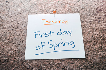 First day of Spring Reminder For Tomorrow On Paper Pinned On Cork Board