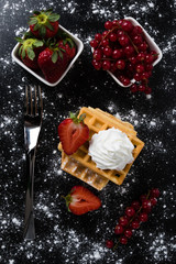 Fototapeta na wymiar waffle with currant and strawberry