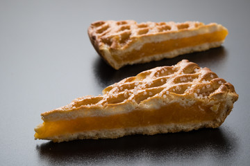 apple pie slice on black table