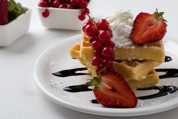 waffle with fruits on white plate