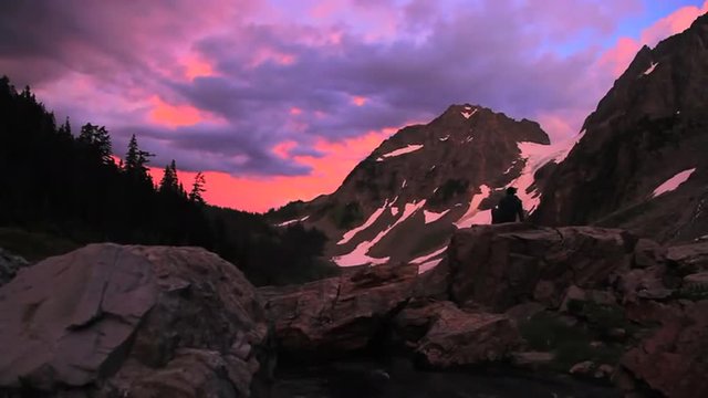A hiker explores the Mt. Lassen wilderness at dusk.