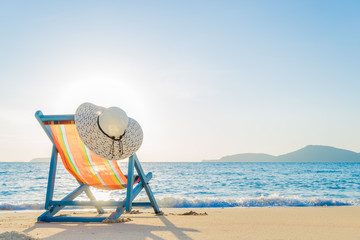 Deck chair at the tropical sandy beach - 104555017