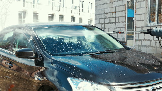 Washing The Car With High Pressure Washer