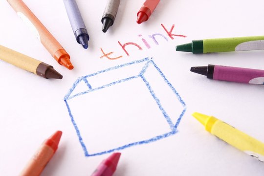 Colorful crayons and the word think