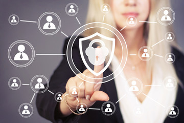Business woman hand press button locked shield security virus