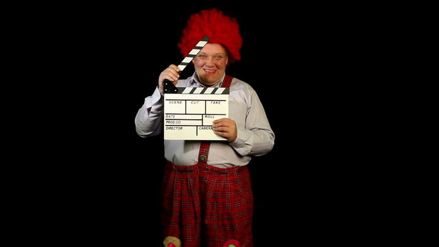 Clown with a movie clapperboard