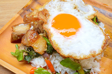 Rice topped with stir-fried pork and basil
