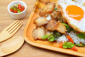 Rice topped with stir-fried pork and basil
