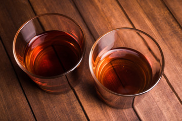 Whiskey drinks on wood table